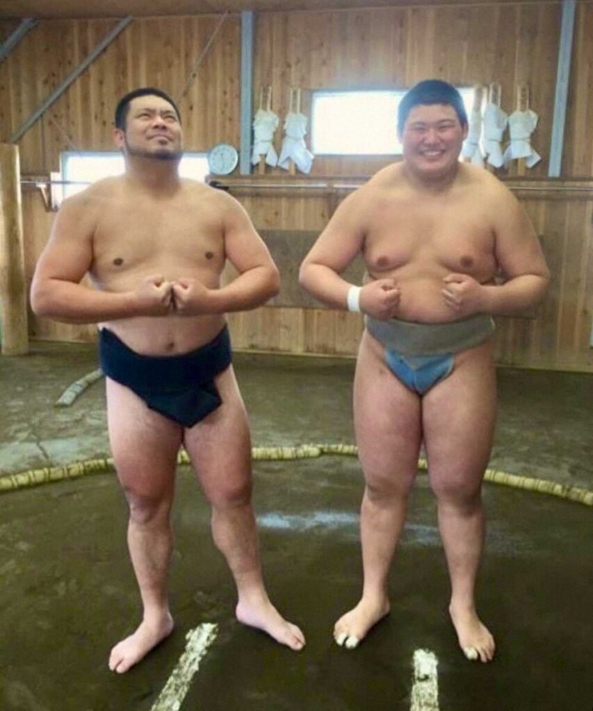 父と本人の写真